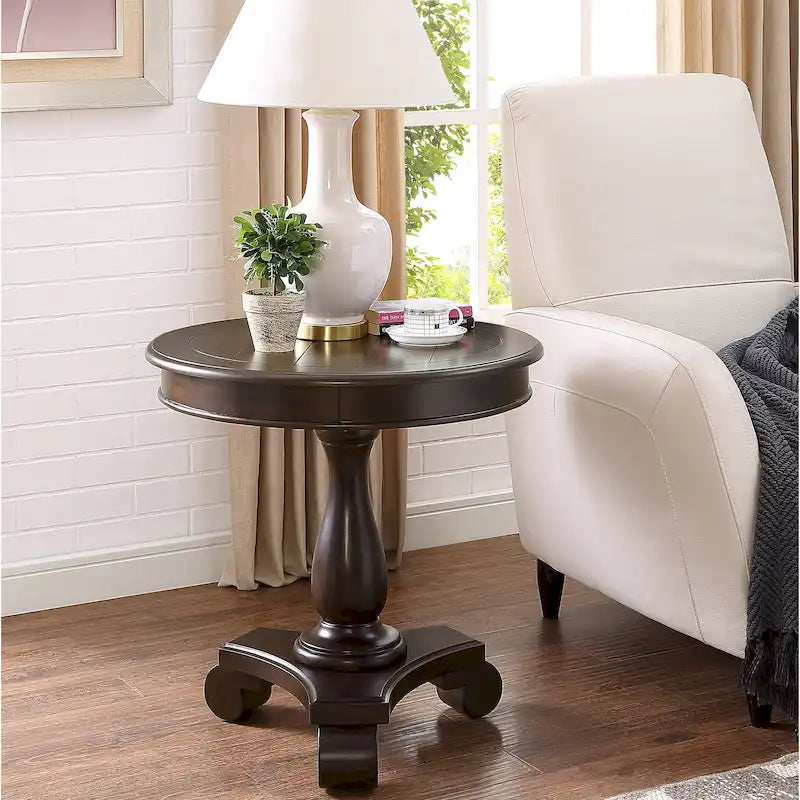 Petite table d'appoint ronde en bois avec pieds sculptés