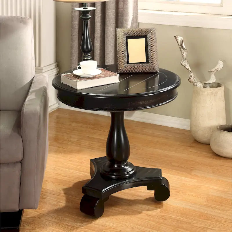 Petite table d'appoint ronde en bois avec pieds sculptés