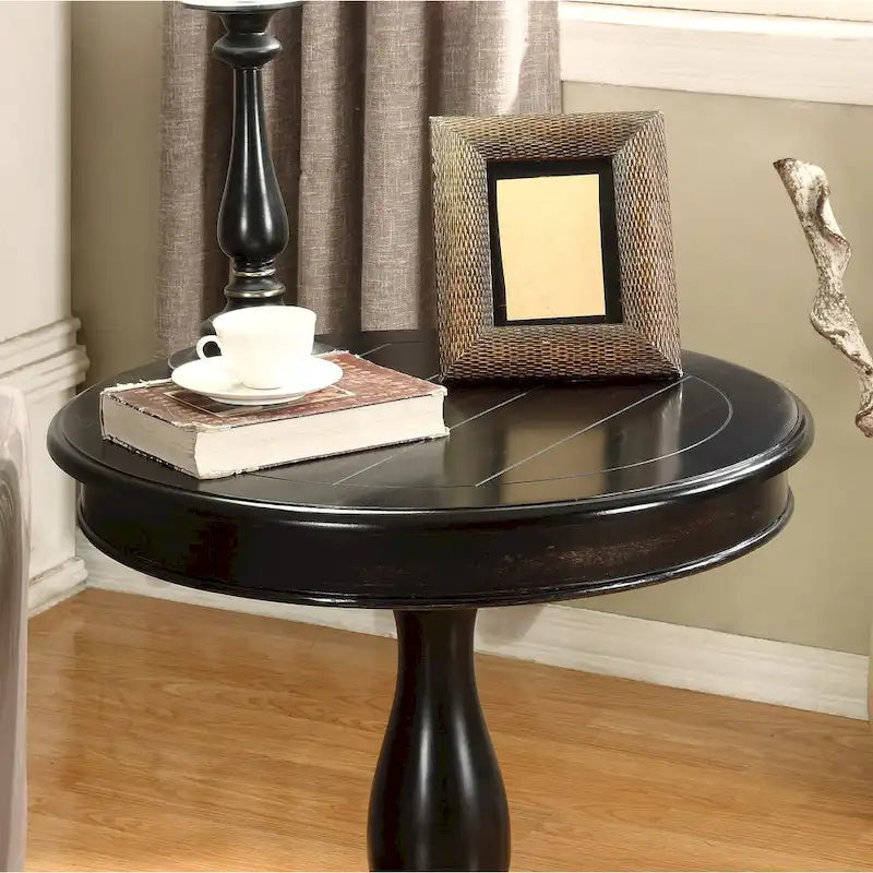 Petite table d'appoint ronde en bois avec pieds sculptés