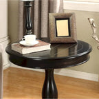 Petite table d'appoint ronde en bois avec pieds sculptés