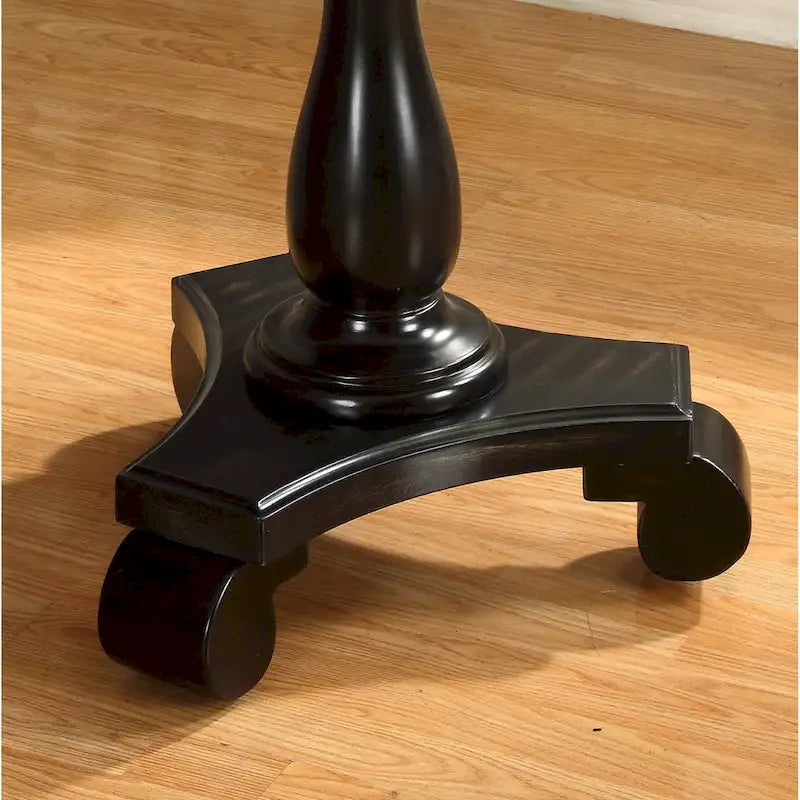 Petite table d'appoint ronde en bois avec pieds sculptés