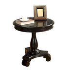 Petite table d'appoint ronde en bois avec pieds sculptés
