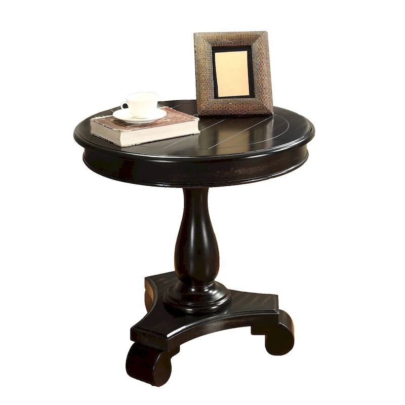 Petite table d'appoint ronde en bois avec pieds sculptés