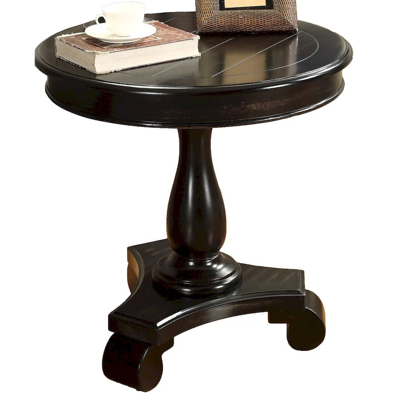 Petite table d'appoint ronde en bois avec pieds sculptés