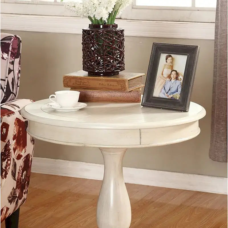 Petite table d'appoint ronde en bois avec pieds sculptés