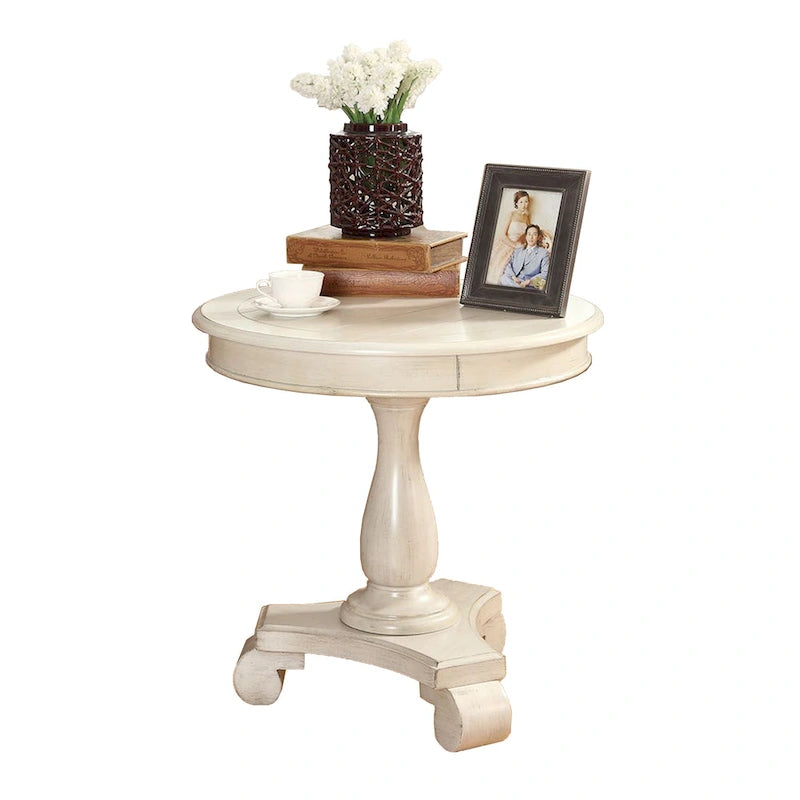 Petite table d'appoint ronde en bois avec pieds sculptés