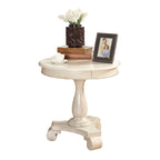 Petite table d'appoint ronde en bois avec pieds sculptés