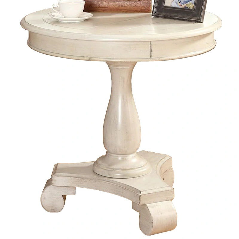 Petite table d'appoint ronde en bois avec pieds sculptés