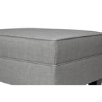 Ottoman capitonné en tissu carré avec passepoil